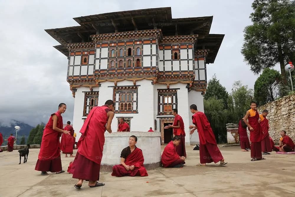 Young monks in the courtyard of a Bhutanese Buddhist college — the world the film is set in