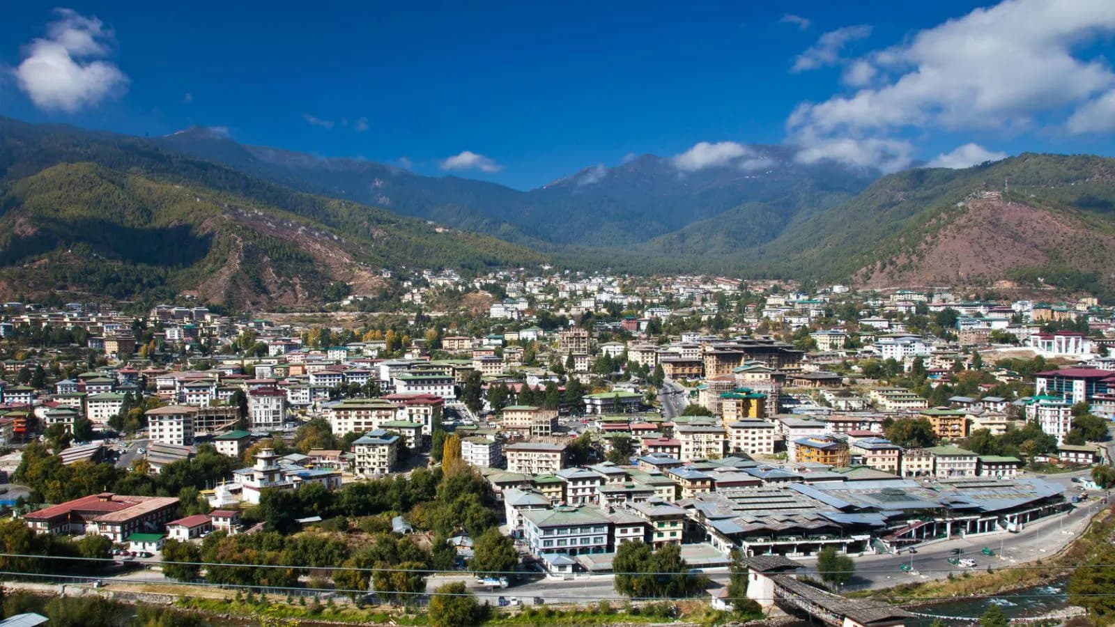 Thimphu valley — the capital city with Tashichho Dzong on the Wang Chhu